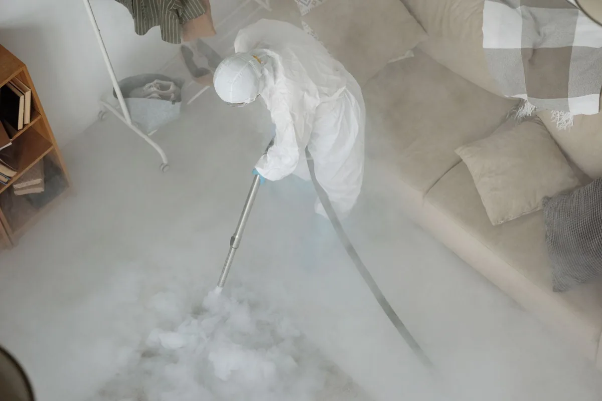 Biohazard cleanup technician in protective equipment, Centerburg, OH